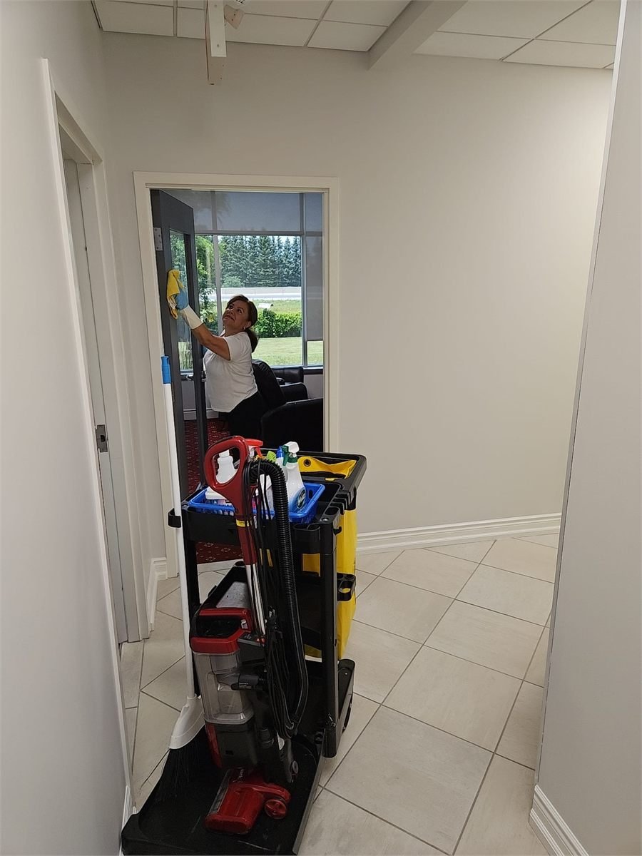 Atana team member cleaning a professional space